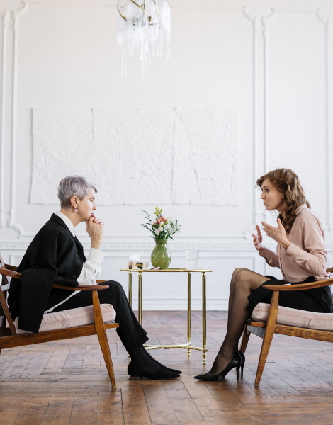 Two women having a face to face consultation discussing the Trust options available