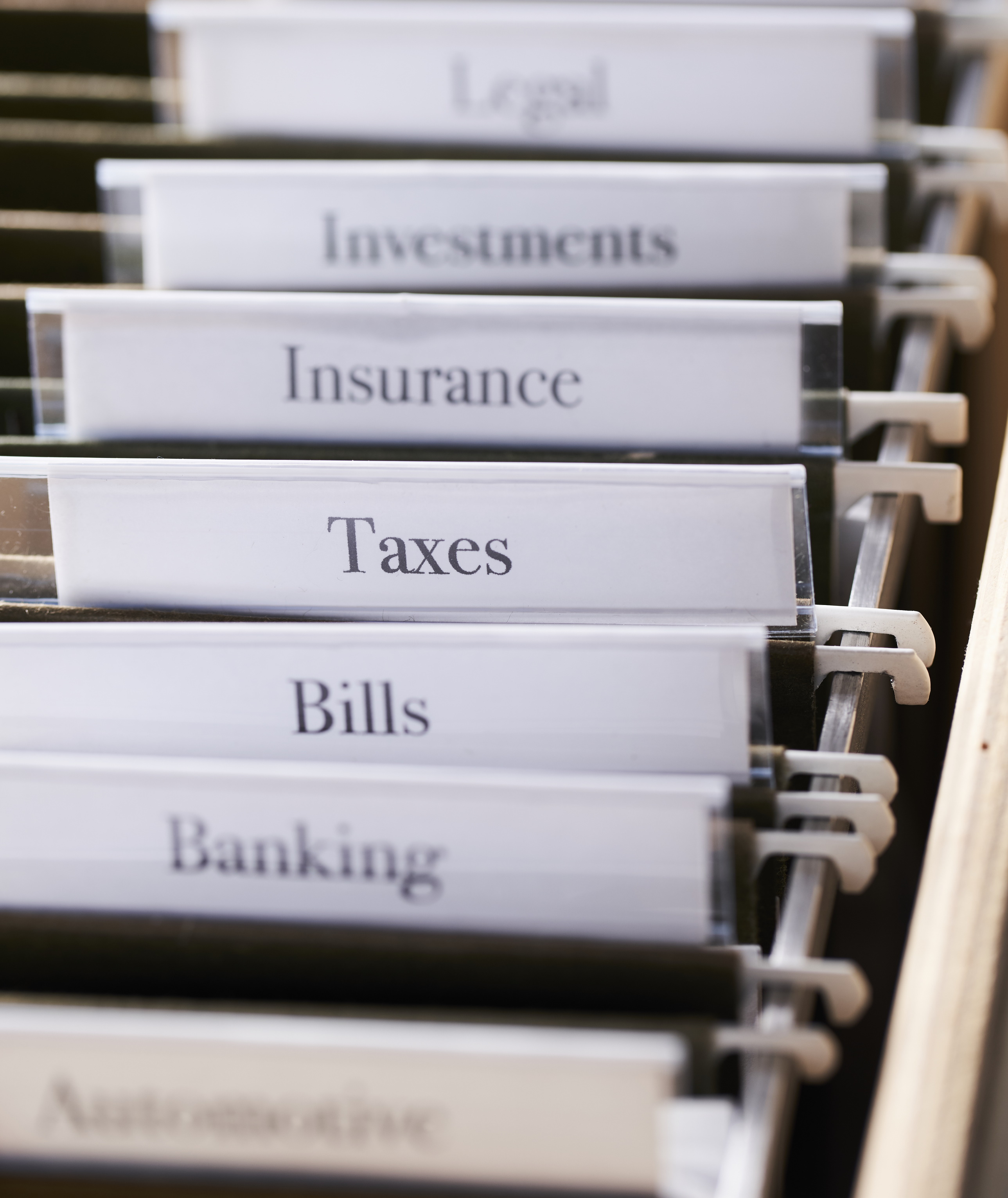 A filing cabinet showing the various types of bills your executors will need to consider